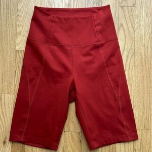 Girlfriend collective red orange biker shorts